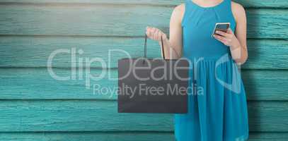 Composite image of women holding bag with blank space