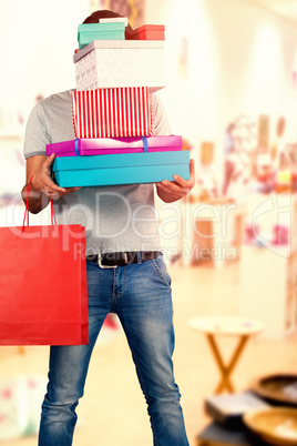 Composite image of full length of man carrying presents