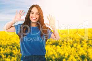 Composite image of portrait of happy female fashion model gesturing