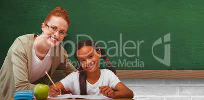 Composite image of happy pupil and teacher