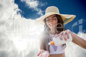 Composite image of beautiful women applying suncream and wearing hat