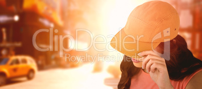 Composite image of female fashion model showing brown cap