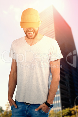 Composite image of portrait of handsome man wearing hat