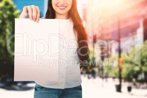 Composite image of beautiful brunette women holding bags