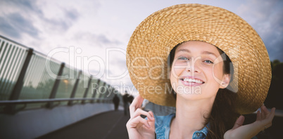 Composite image of portrait of beautiful blonde women wearing hat