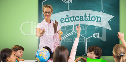 Composite image of students raising hands while teacher teaching