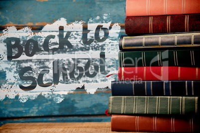 Composite image of back to school text on pink splash