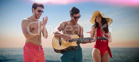 Composite image of friends playing music in swimwear