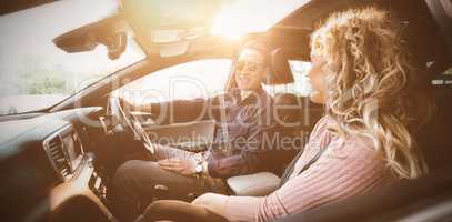Couple talking while sitting in car