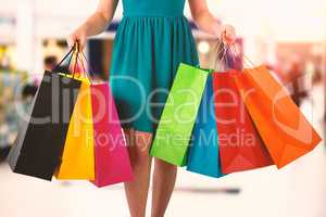 Composite image of women holding shopping bag