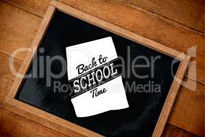 Composite image of graphic image of back to school text on paper