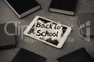 Composite image of back to school text on pink splash
