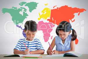 Composite image of children writing on books at table