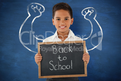 Composite image of schoolboy holding slate with text over white background