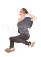 Woman sitting on floor and looking up