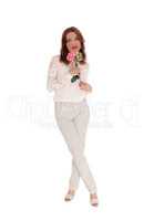 Lovely woman with pink rose standing full body