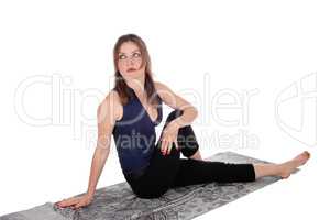 Exercising woman sitting on floor, resting
