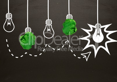 light bulbs with crumpled paper balls in front of blackboard