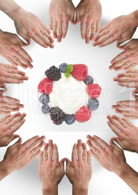 Hands in circle around fruit berries