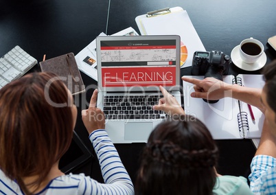 People pointing to a computer with e-learning information in the screen