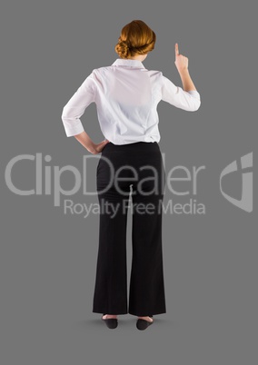 Full body portrait of woman standing with grey background