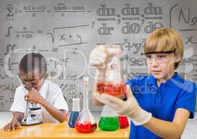 Science kids with blank grey background with science equations graphics