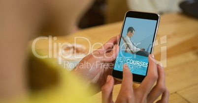 Woman using a phone with e-learning information in the screen
