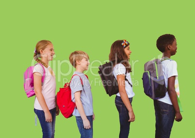 Kids with bags in front of green background