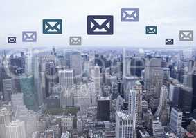 Email icons over city