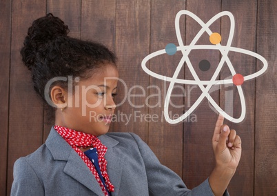 Office kid girl pointing at a science icon against wood wall background