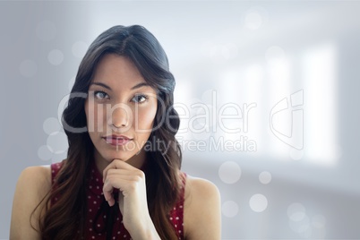 Business woman standing against white blurred background