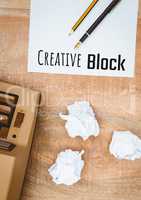 Creative block  text written on page with typewriter and crumpled paper