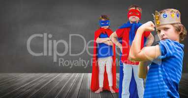 Superhero kids and king crown boy with blackboard background