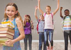Kids jumping for joy in room with books
