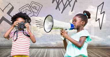 kids holding megaphone and camera with cloudy room background and drawings