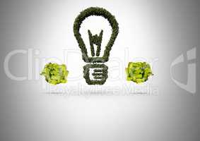 green nature light bulb with crumpled paper balls
