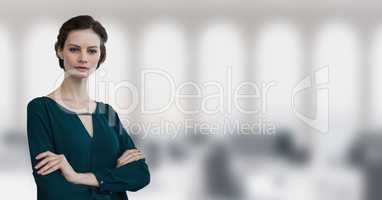 Business woman standing against office background