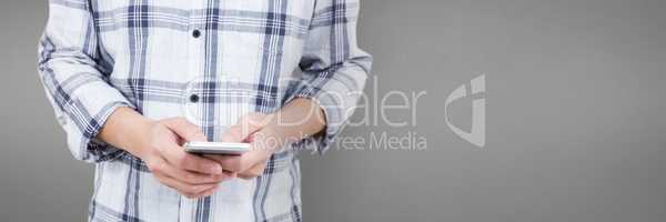 Man using a phone against grey background