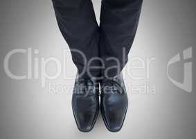 Businessman feet and legs with business attire and black shoes