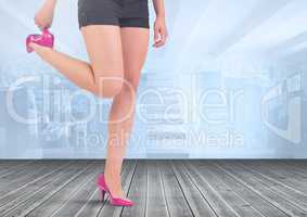 Slim athletic legs on wooden floor