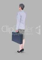 Full body portrait of businesswoman standing with grey background