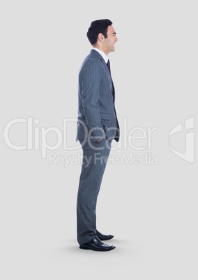 Full body portrait of man standing with grey background
