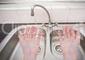 Washing hands in sink