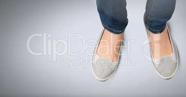 Womans feet and shoes on blue background