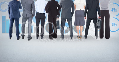 Group of business people standing in front of statistics performance charts
