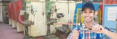 Happy mechanic man fixing pipes