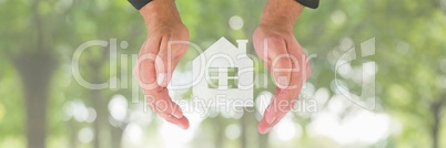 Hands holding a house icon as house insurance concept