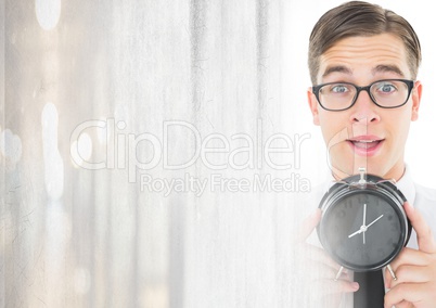 man holding clock in front of bright light