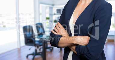 Business woman standing against office background