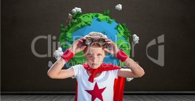 Superhero boy in front of planet earth world with blackboard background